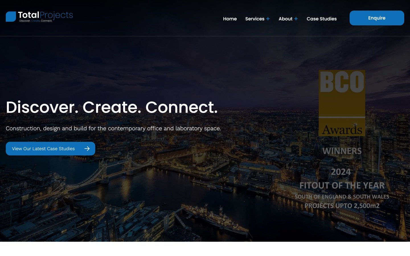 The Total Projects homepage on a laptop